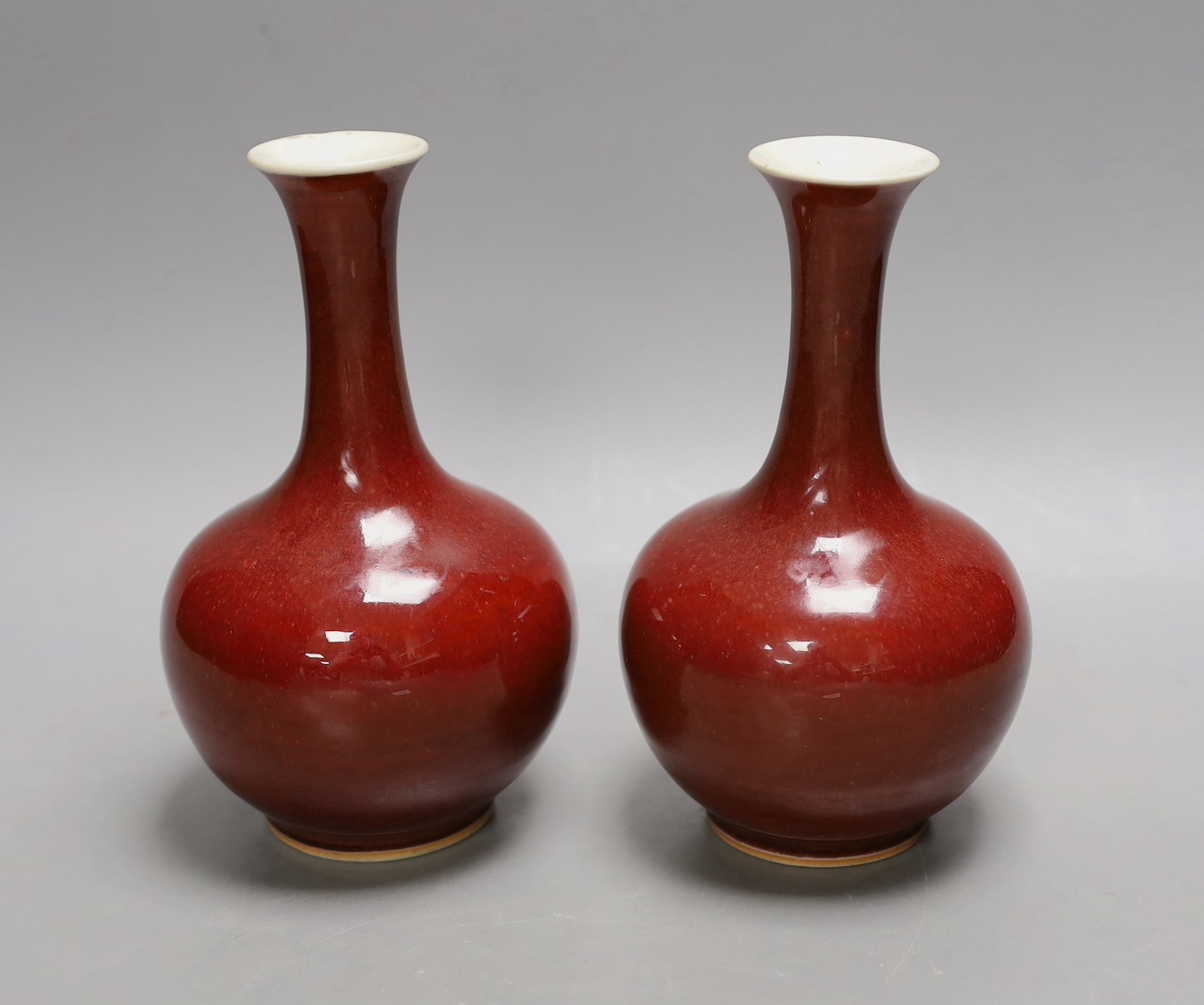 A pair of Chinese sang de boeuf glazed vases, early 20th century, 20cm high